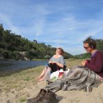 friends by a river in portugal